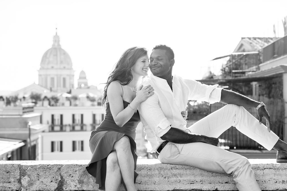 Black and white photography of a couple photographed while sitting down