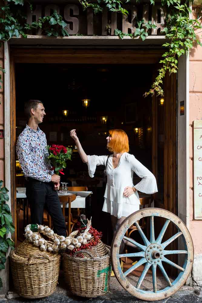 Italian style attitude during a photo session at a typical restaurant in the Trastevere area