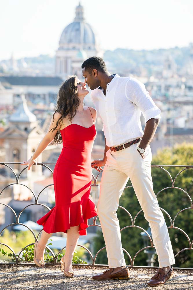 Kissing on the Pincio park terrace with the city of Rome in the background