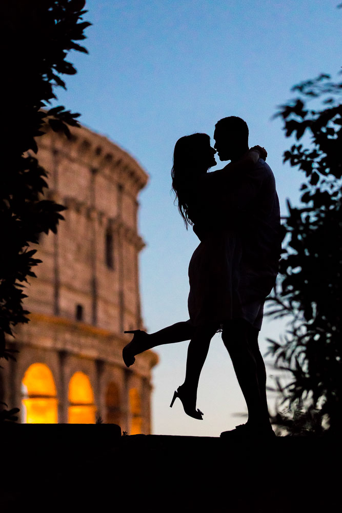 Silhouette Couple Photo Shooting at the Roman Colosseum in Rome Italy. Image taken at dusk