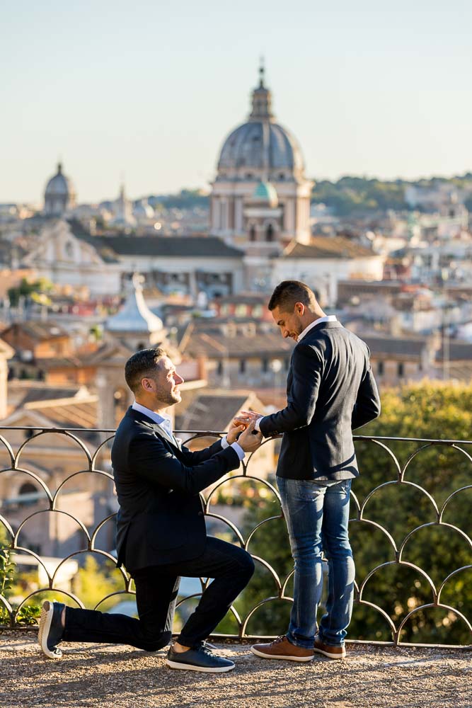 Same sex wedding marriage proposal overlooking the beautiful roman skyline from the Pincio park overlook