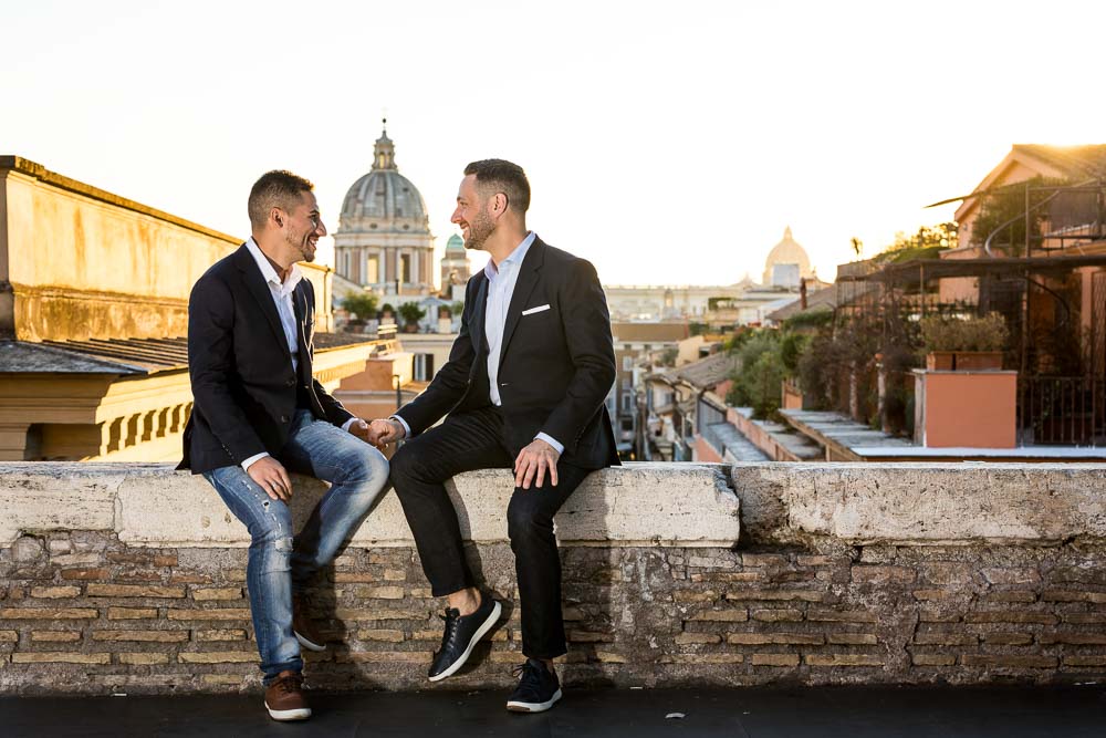 Sitting down on a marble ledge talking and chatting during a photo shoot in Italy