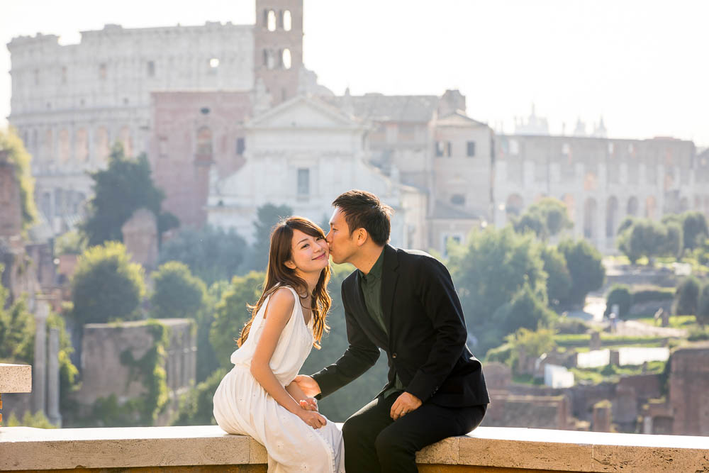 Romantic picture of a couple kissing in the ancient roman city