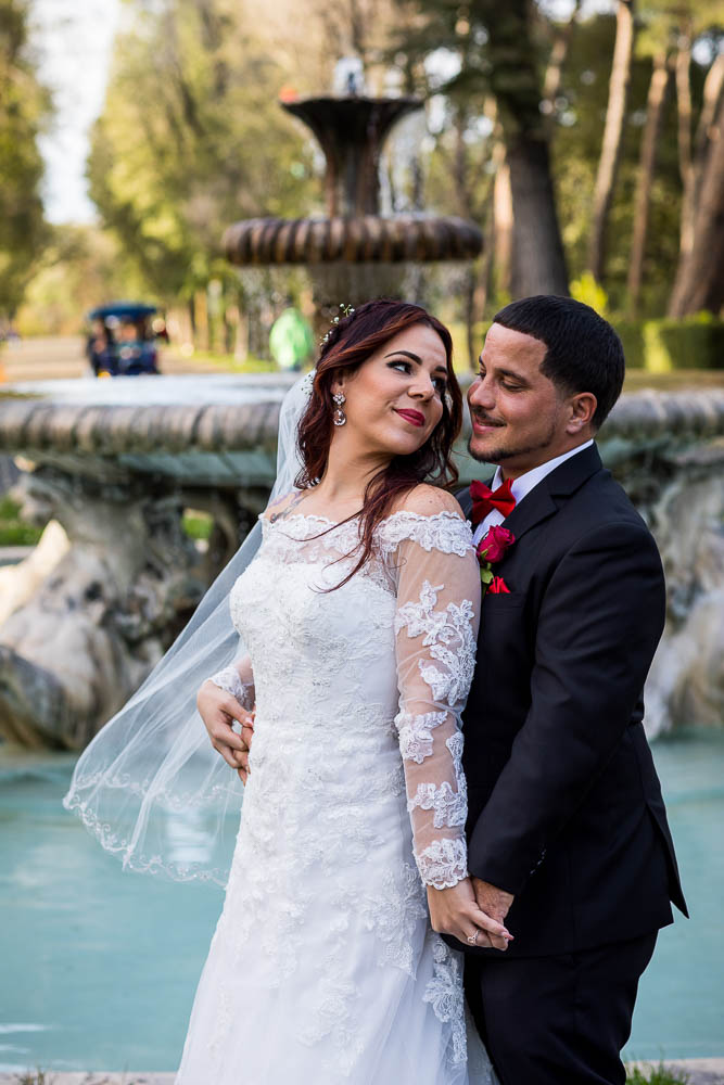 Bride and Groom looking at each other during the photography session portraits in Villa Borghese Park