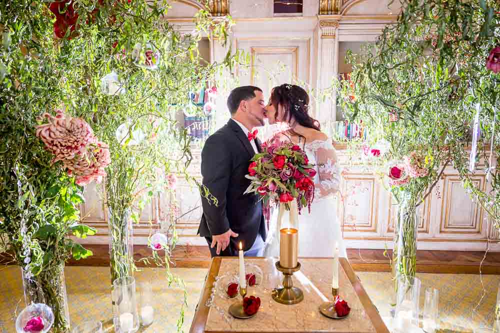 Just married bride and groom kissing after the private ceremony