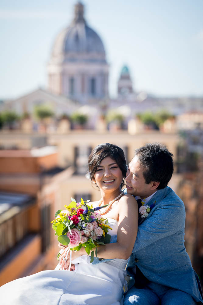 Portrait picture sitting down in front of the spectacular view over the roman skyline