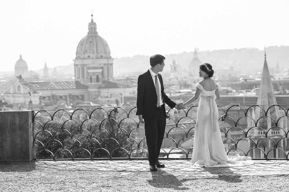 Black and white photography taken on the Pincio terrace park overlooking the city of Rome from above