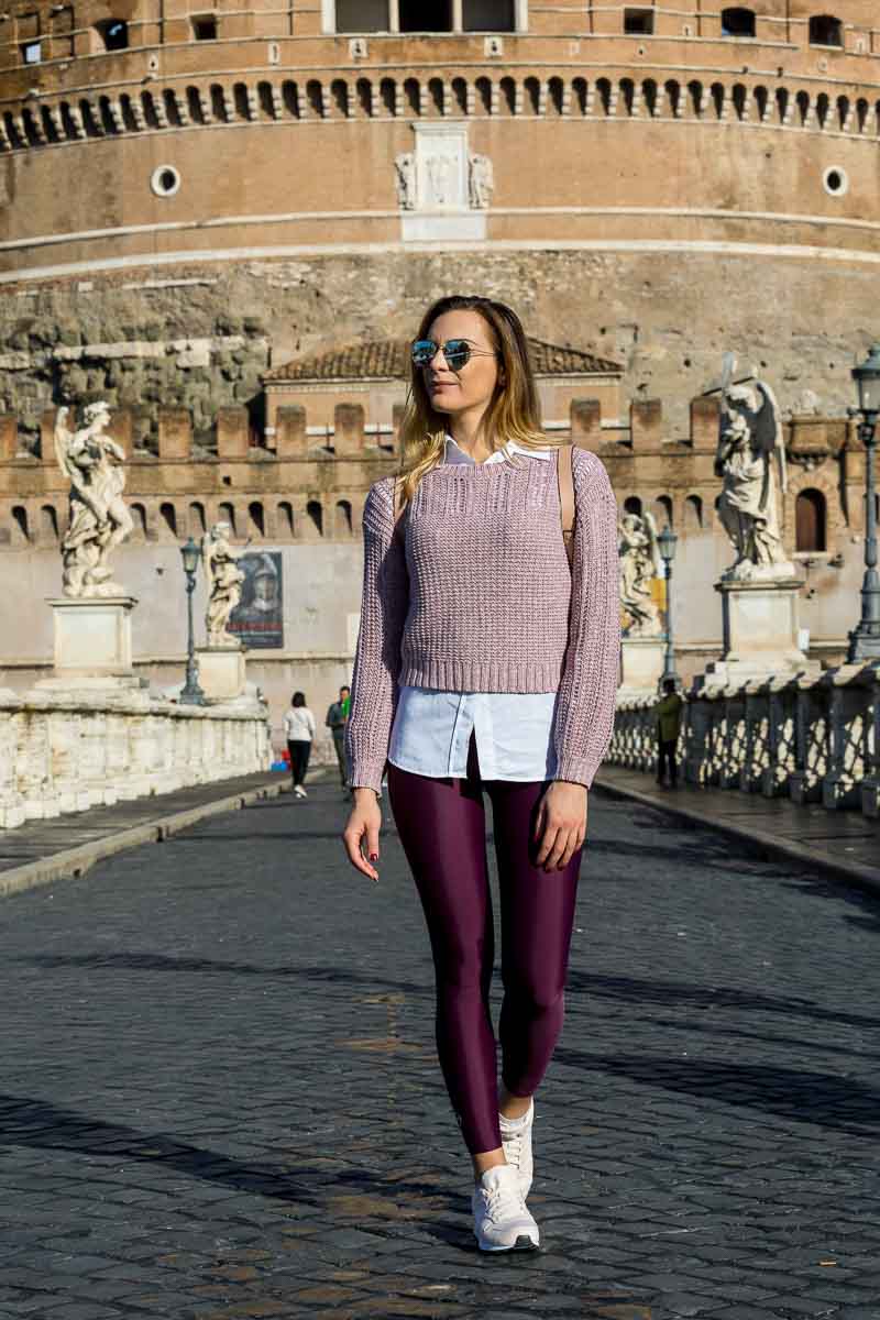 Model walking on Castel Sant'Angelo bridge in the early morning