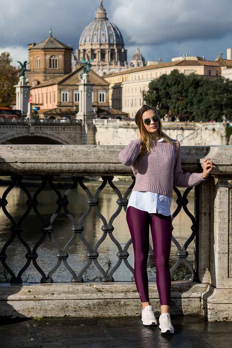 Standing sideways on the Ponte Castel Sant'Angelo