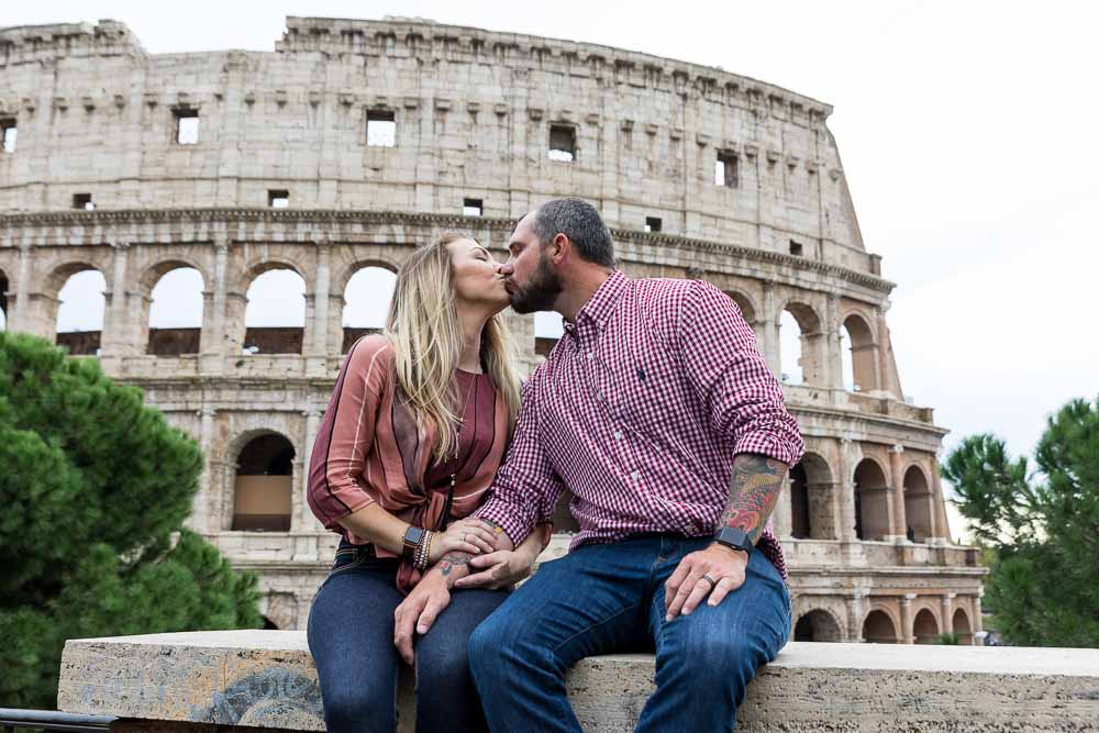 Kissing at the Roman Colosseum in Rome Italy