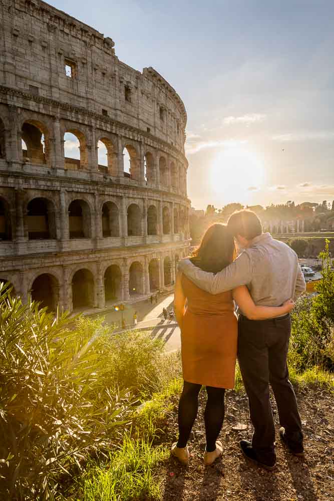 Romantic Couple Photography while looking at the sunset by the colosseum