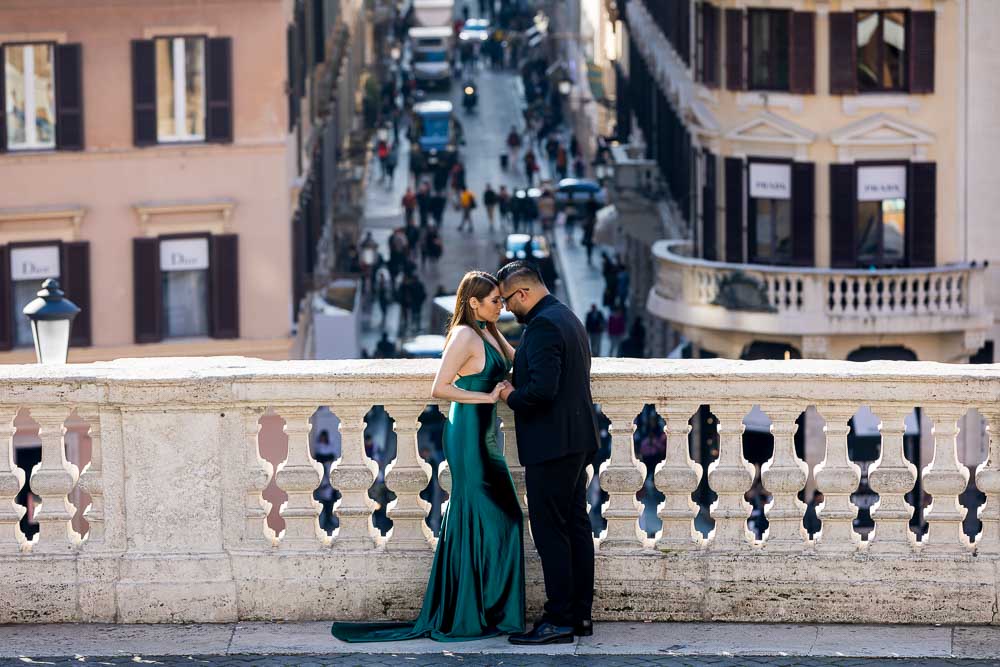 Standing close together by the marble terrace of Piazza di Spagna