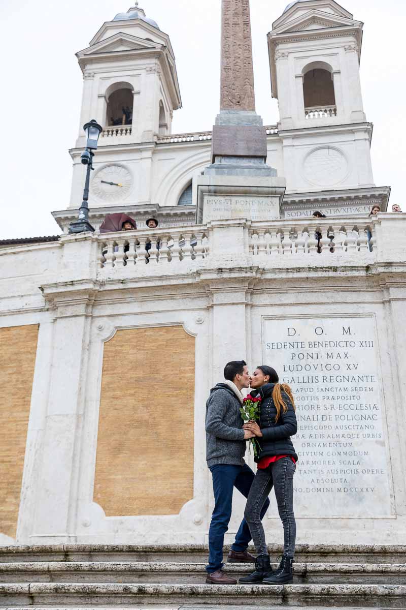 Kissing under the Church found on top of Piazza di Spagna