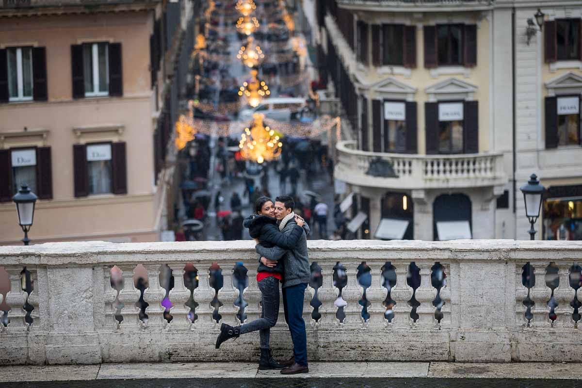 Couple photoshoot with Via Condotti embellished with beautiful Christmas lights