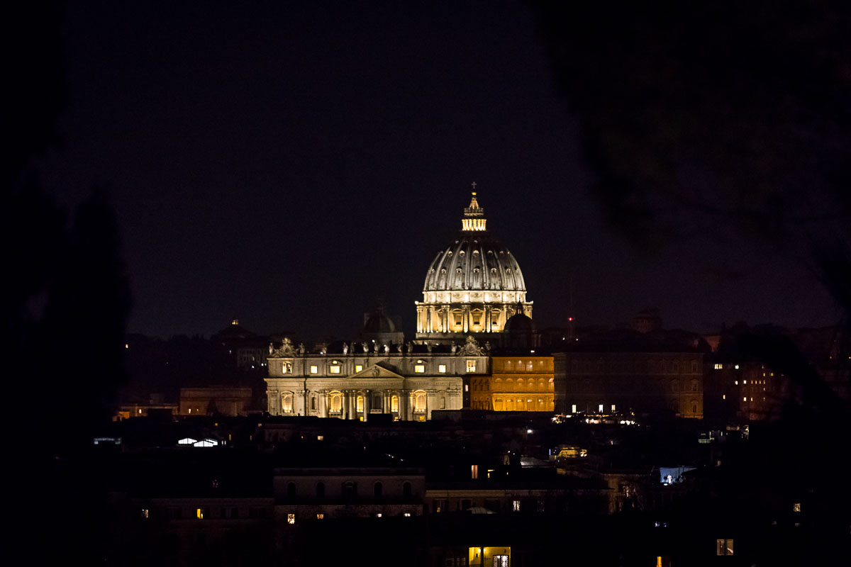 The view of Saint Peter's dome in the far distance Rome at night