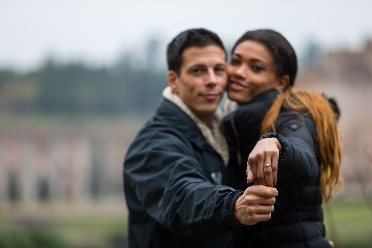 Showing the engagement ring after getting engaged in Rome Italy