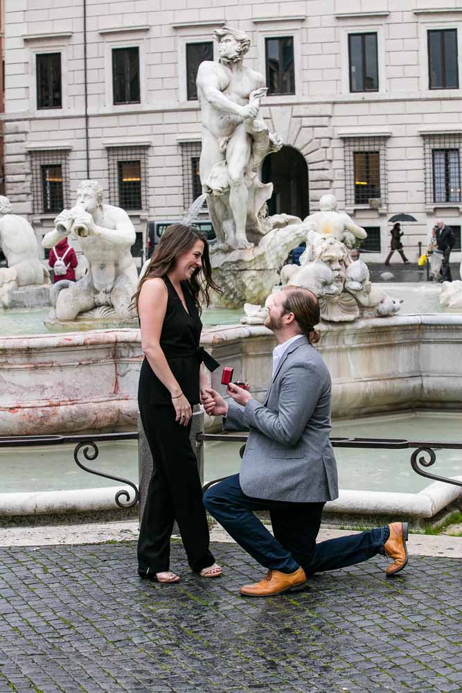 Knee down wedding marriage proposal in the city of Rome