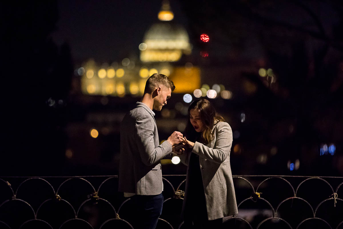 Putting on the engagement ring on hand