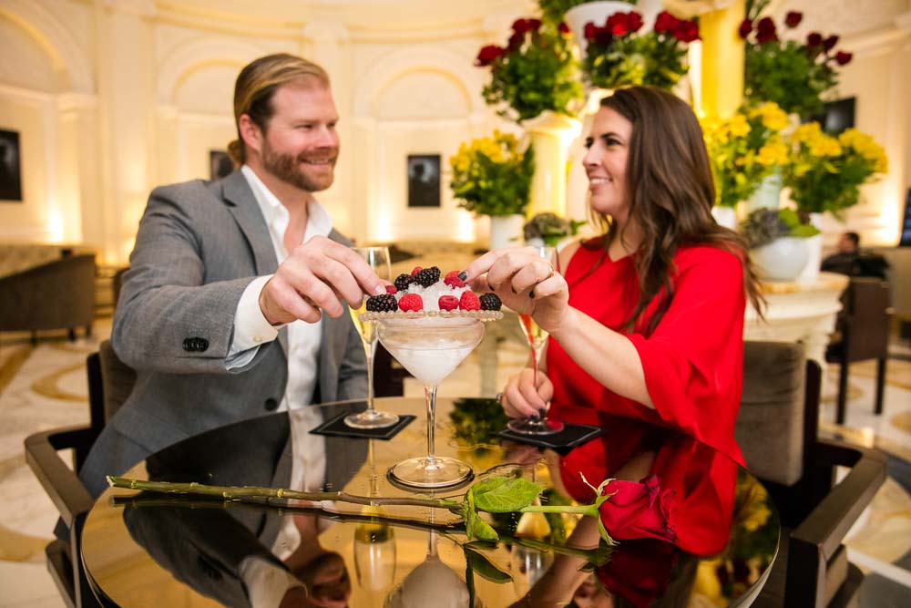 reaching out for fresh berries during en engagement session