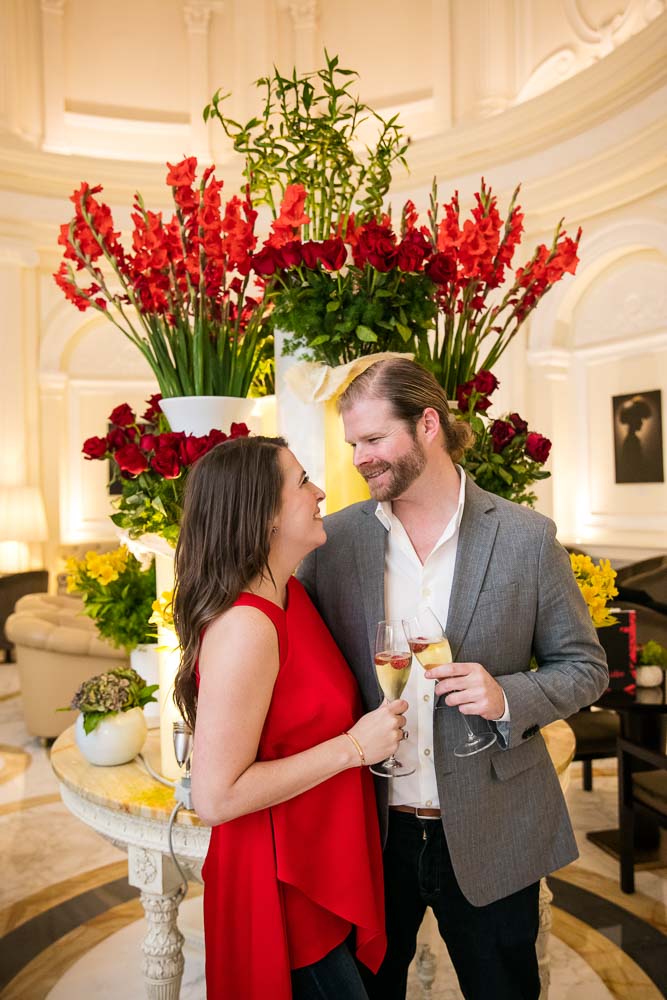 Couple portrait picture before beautiful red flowers