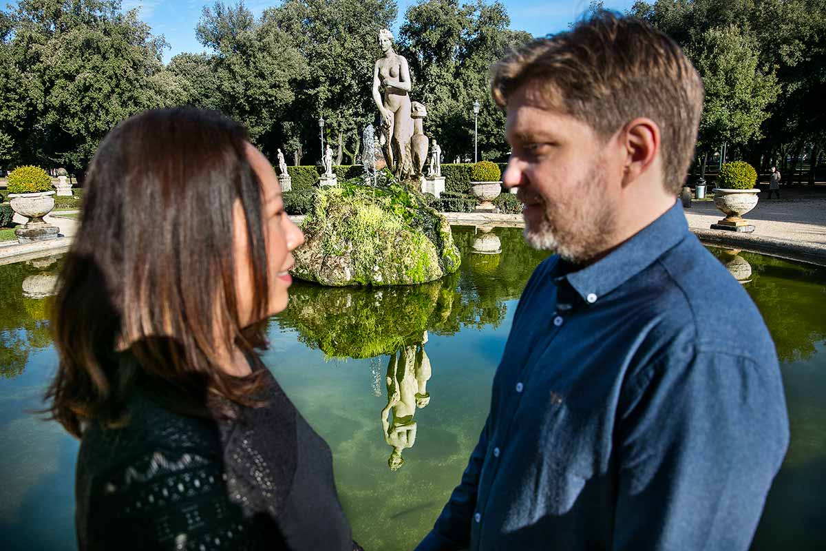 Couple reflection image during a photo session in Villa Borghese park in Rome