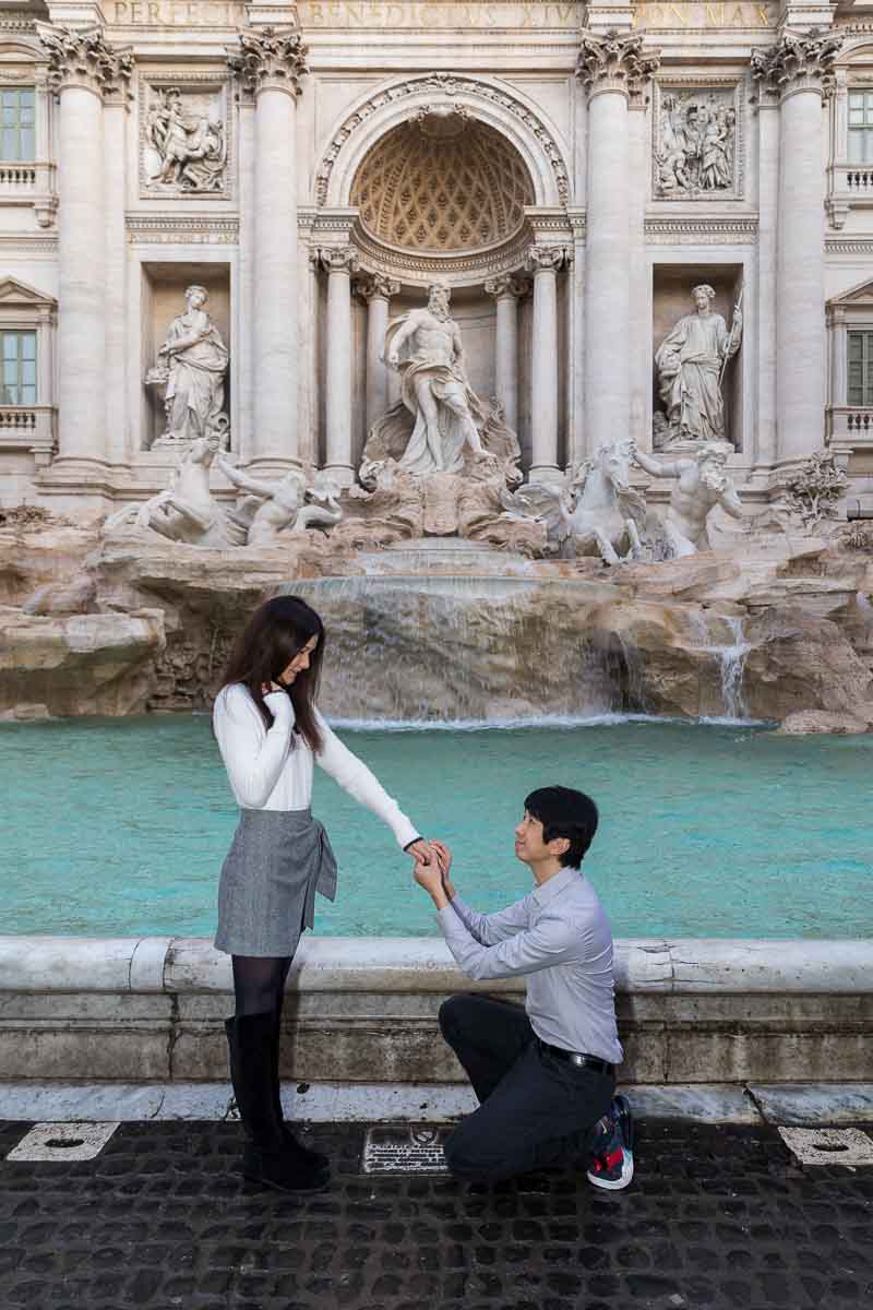 Wedding marriage proposal asked at the center of the Trevi fountain in the early morning