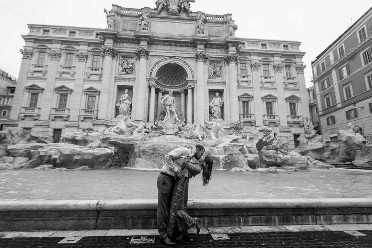 Black and white image. Honeymoon photo shoot at the Trevi fountain in Rome Italy.