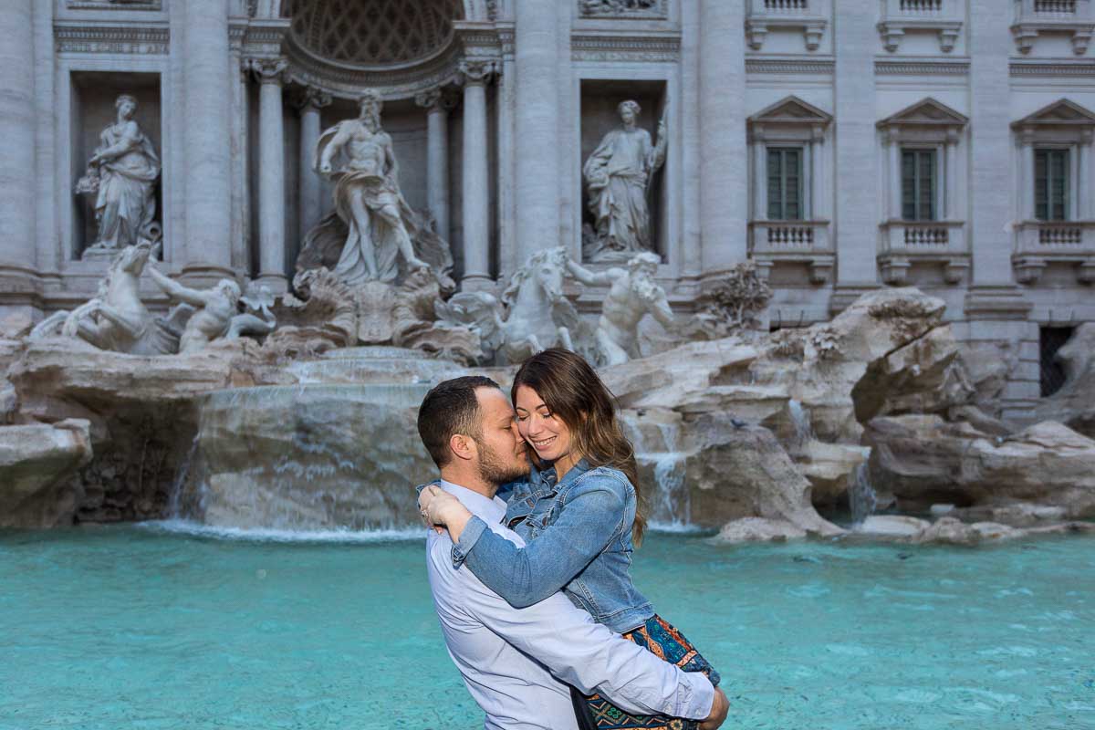 Closed in portrait of a couple in love photographed at the Trevi fountain suring a photo shoot