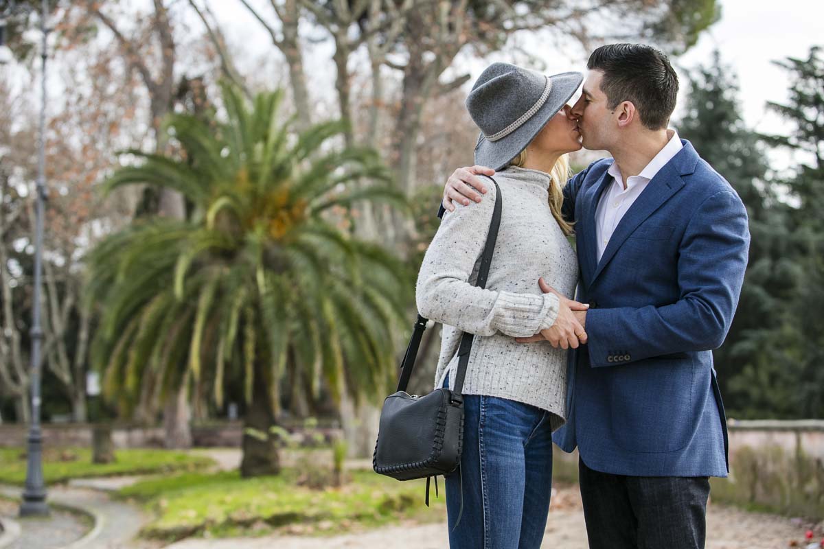 Portrait kiss in a green park