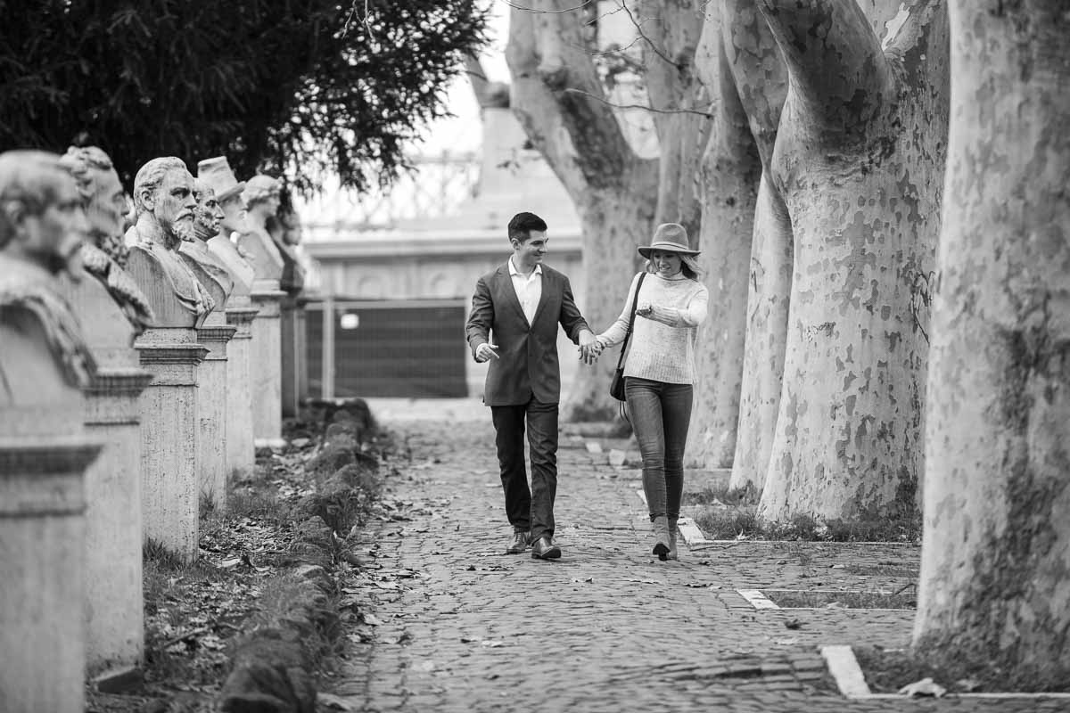 Walking hand in hand in the roman street and alleyways. Black and white photography