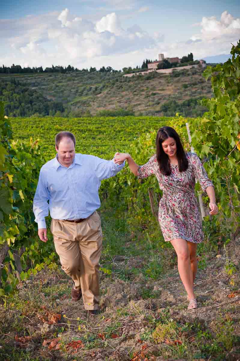 Couple walking hand in hand in a vineyard Tuscany Italy during a Florence Photographer session