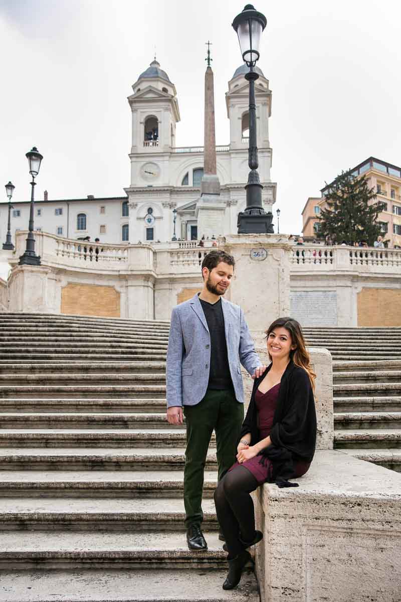 Sitting down posed picture in front of church trinità dei monti and the staircase