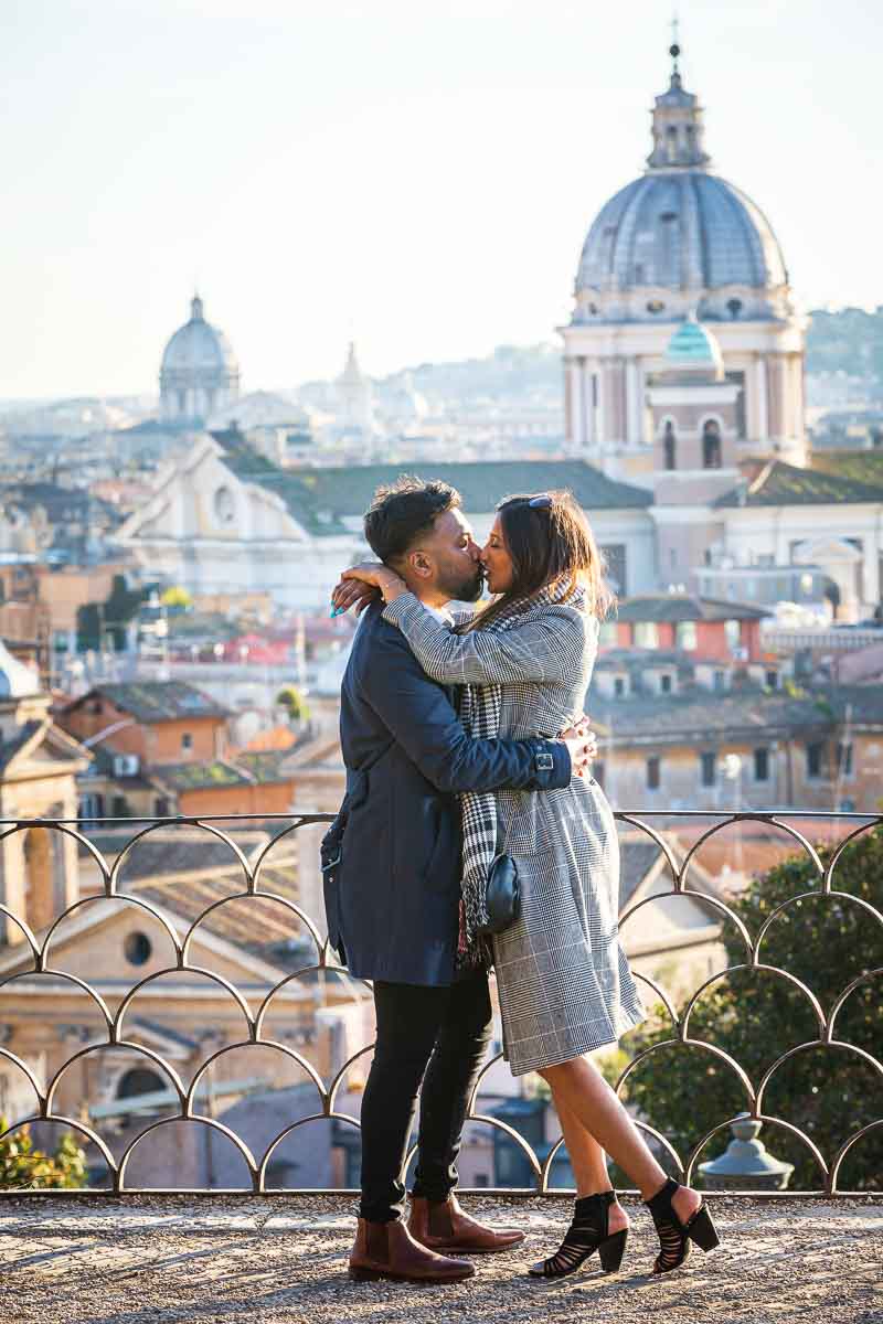 Kissing during a couple photoshoot in the ancient city of Rome