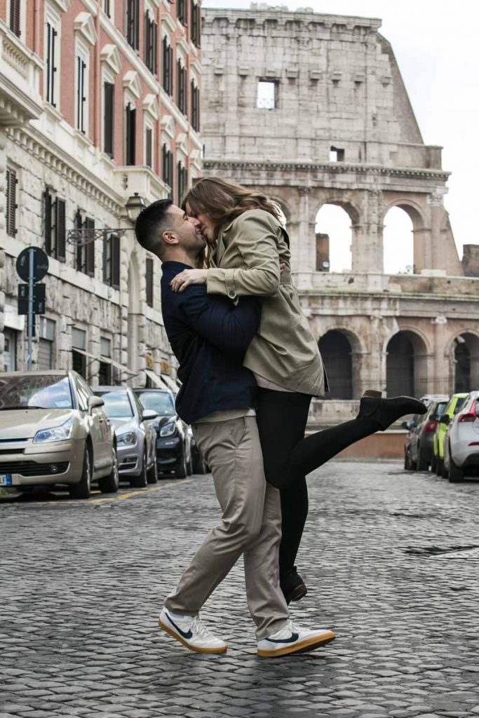 Color image version of a couple kissing in Rome during an engagement photo shoot