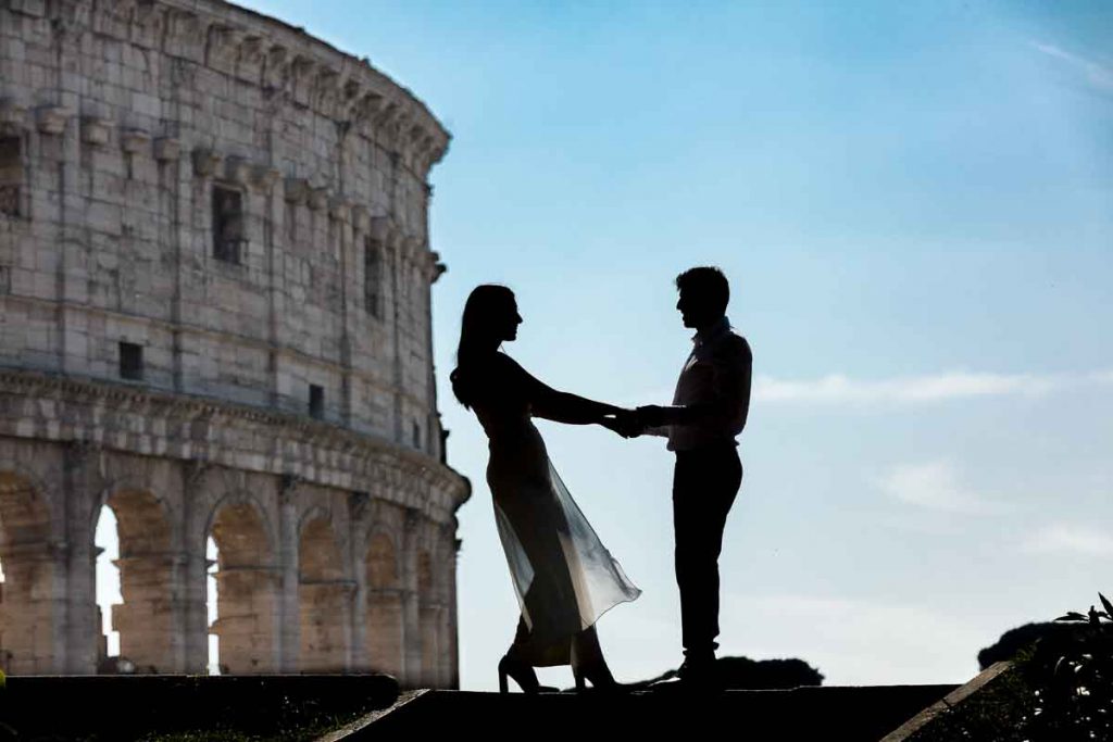 Silhouette image of bride and groom posing in front of the Colosseum