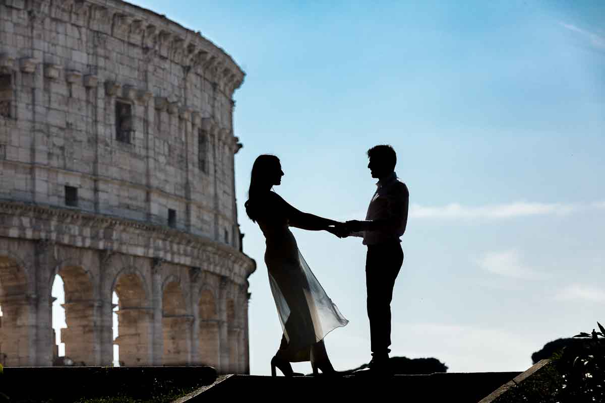 Silhouette image of bride and groom posing in front of the Colosseum. Rome Pre Wedding Photography.