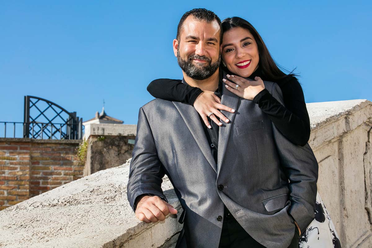 Just engaged portrait picture on the Spanish steps underneath clear blue sky