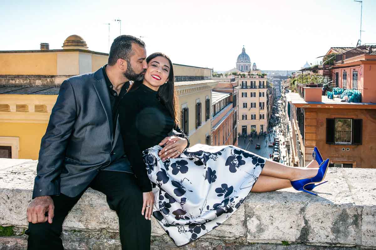 Kissing on the cheek with the city of Rome in the backdrop