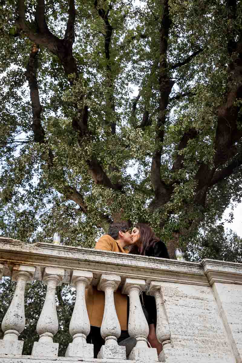 Kissing underneath a tree