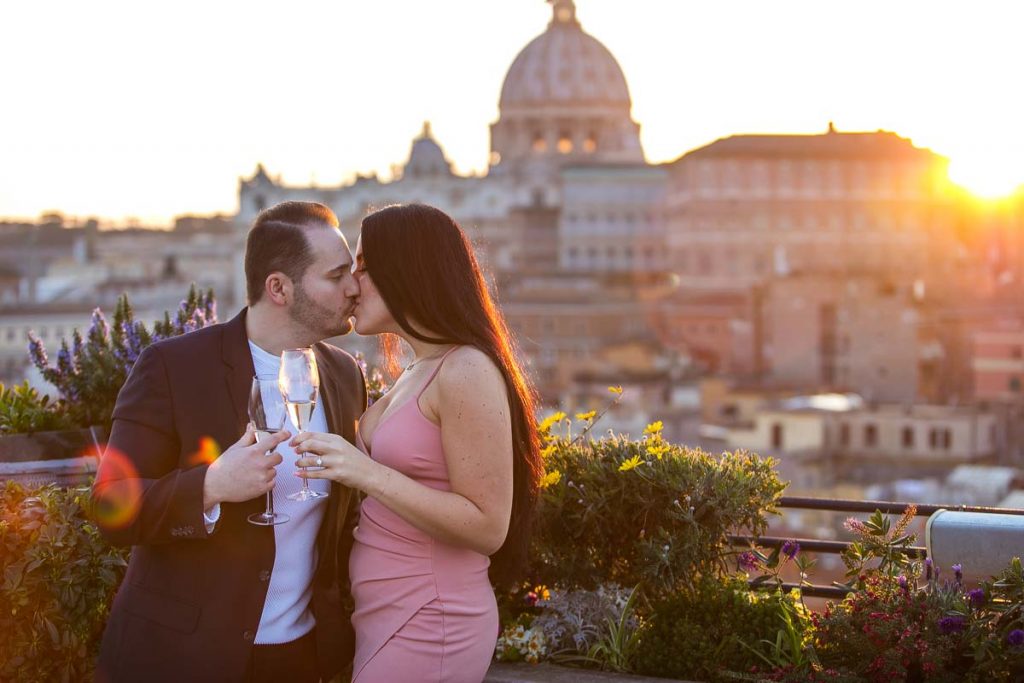 Just engaged. Celebrating engagement during a unique and creative photo session overlooking the roman skyline at sunset