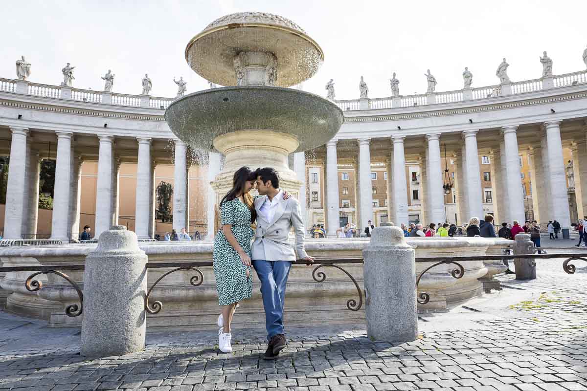Taking photos together in the square during an engagement session