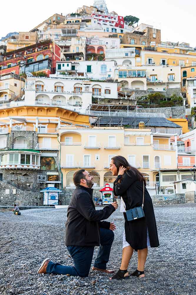 Jumping for joy during and engagement session after a surprise proposal