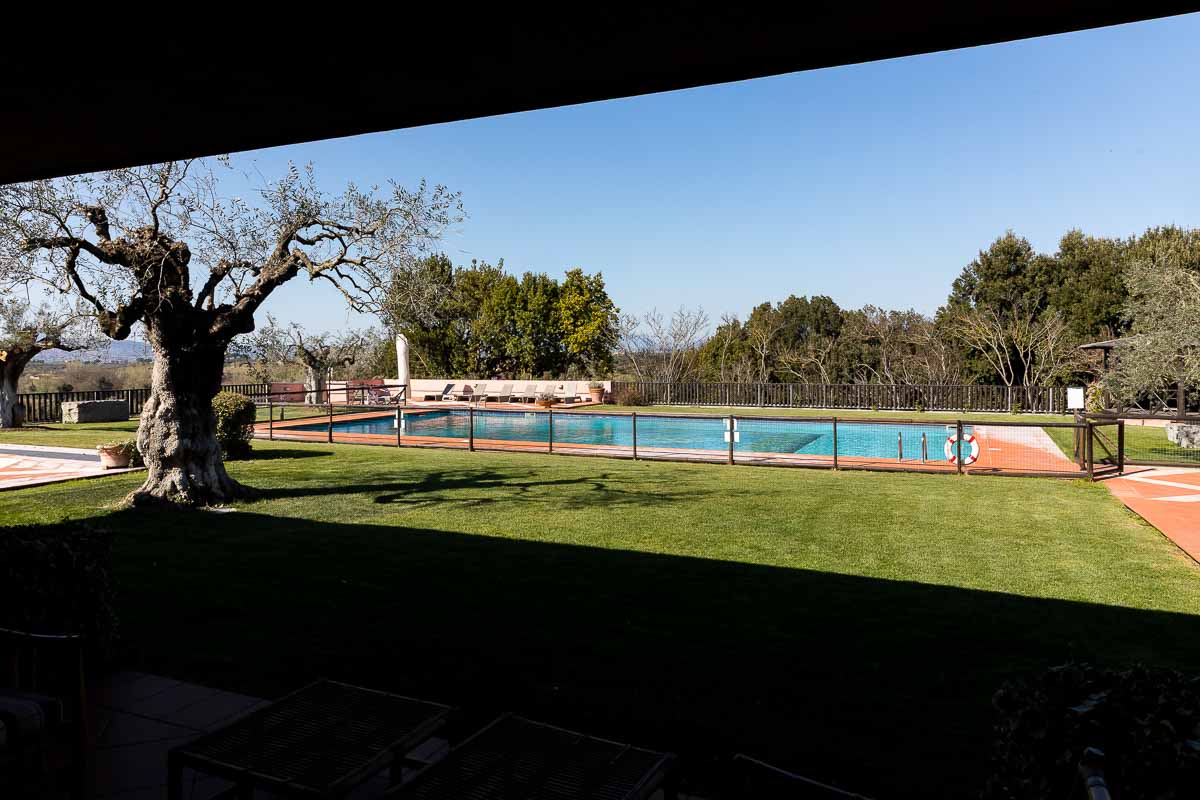 Garden view with a pool in the back of the exclusive villa