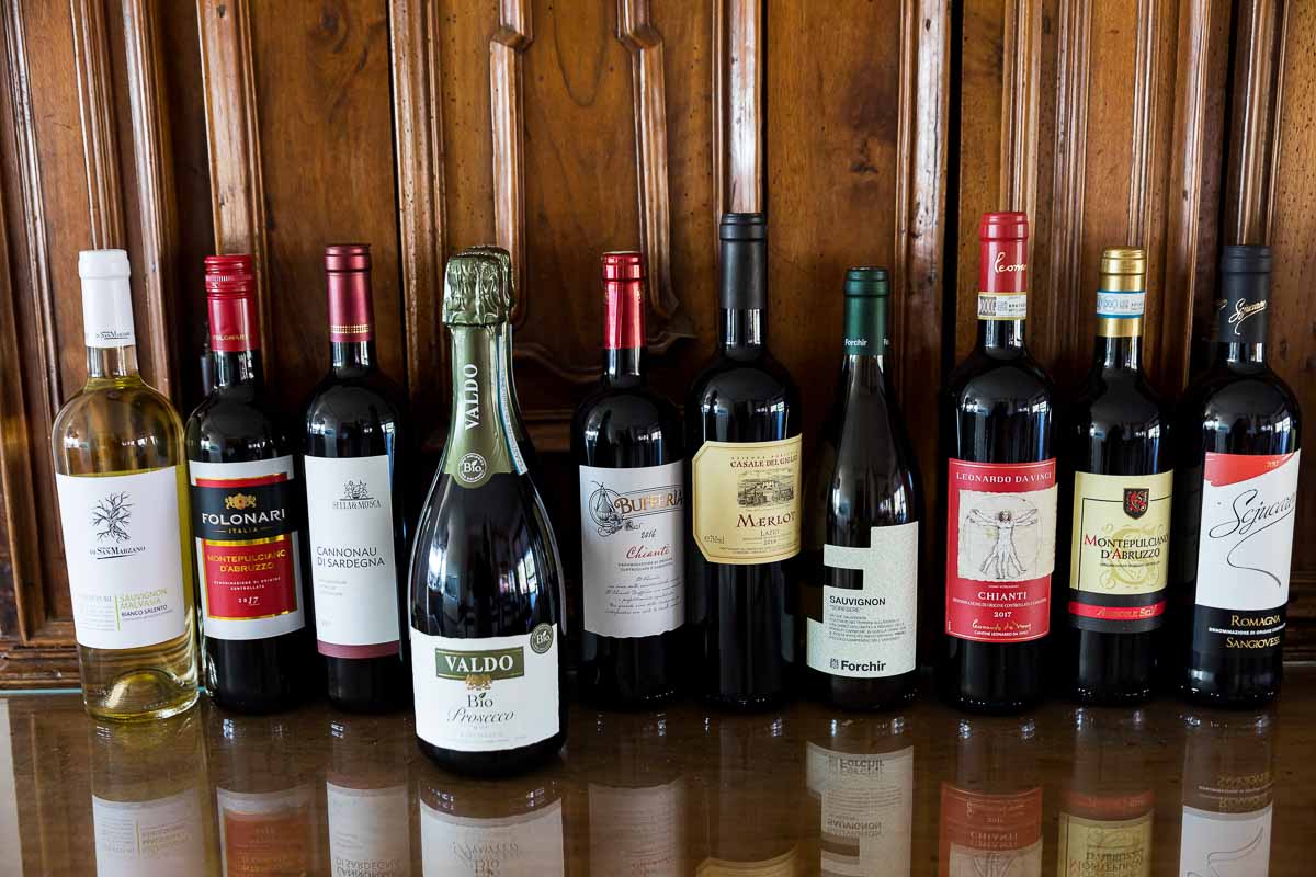 Wine bottles set on a row in preparation of the dinner