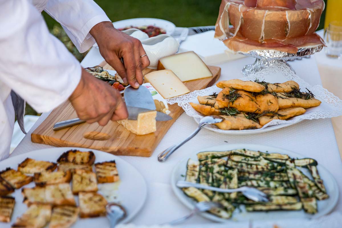 Reception displaying a selection of typical Italian food products including cheeses and other delicatessens