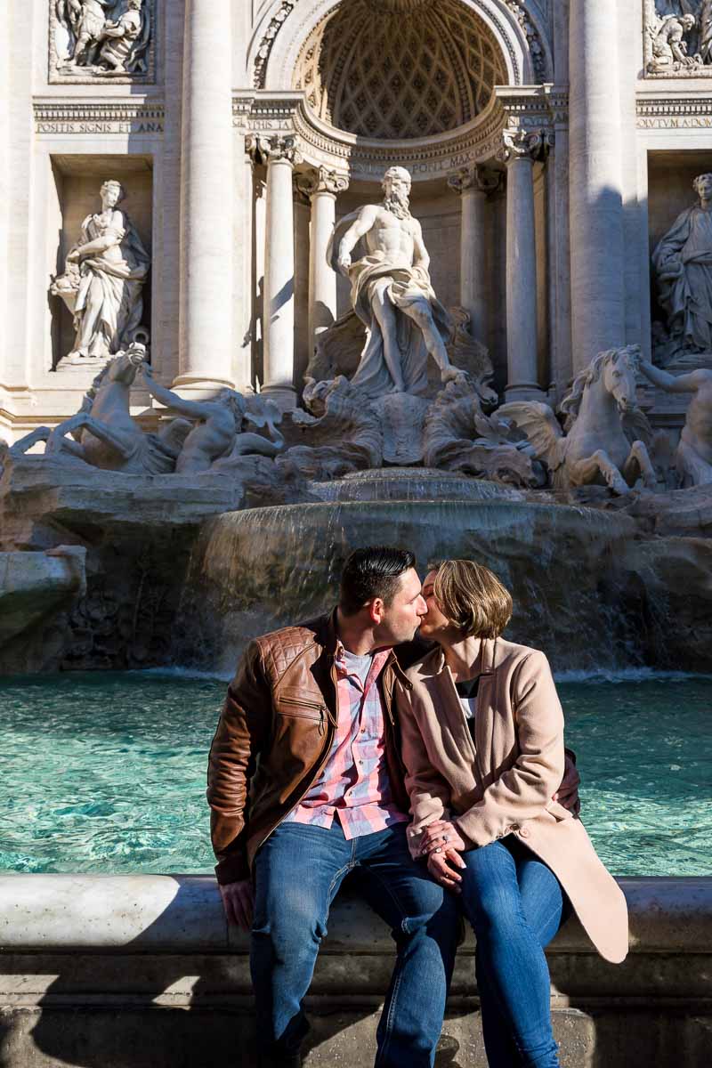 Couple just engaged kissing before Fontana di Trevi
