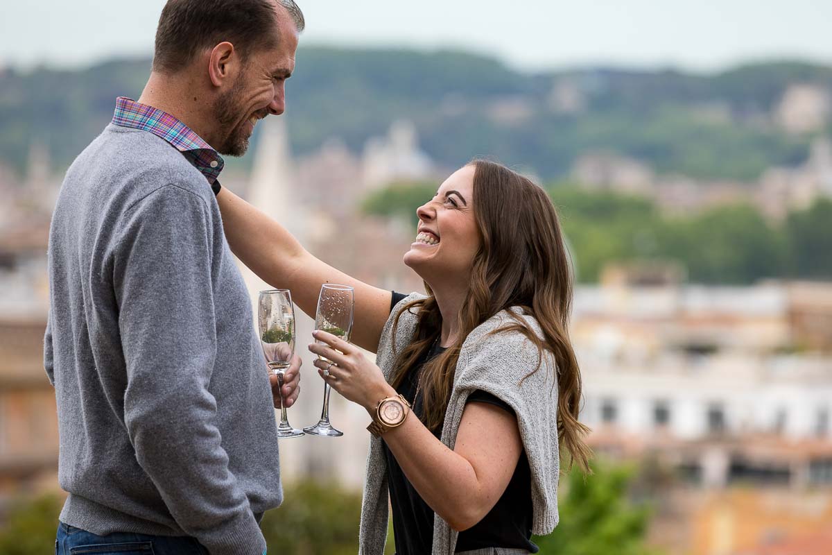 Couple celebrating holding glass flutes with Italian prosecco dry sparkling wine