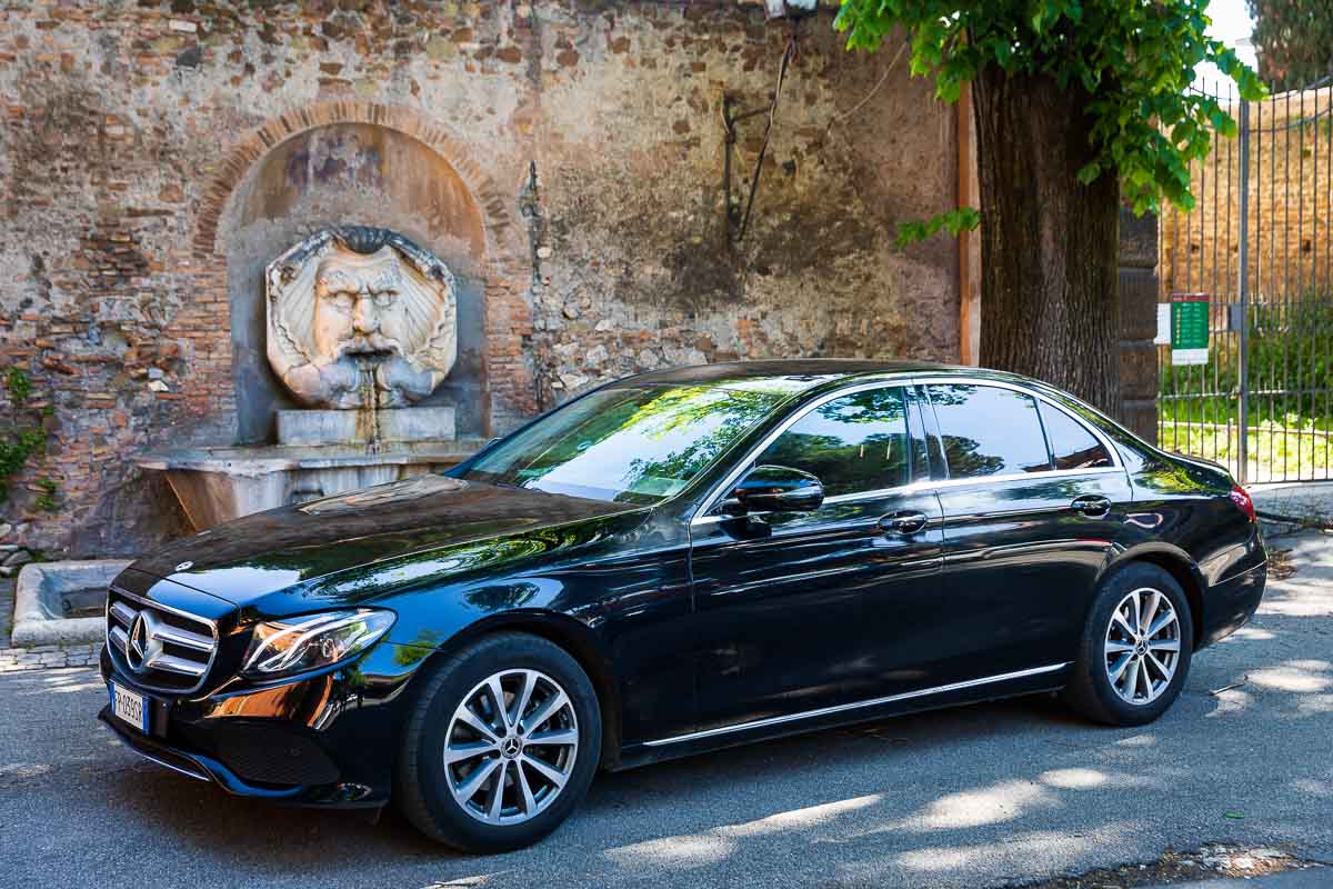 The wedding car service black Mercedes E class sedan