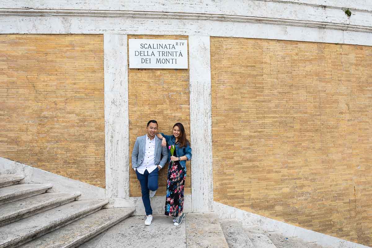 Portrait picture of a couple standing on the Spanish steps