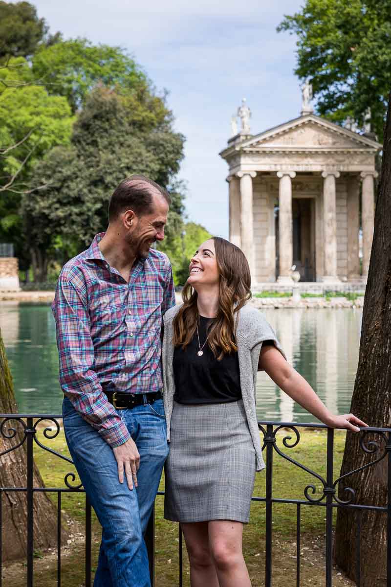 Engagement portrait picture with Villa Borghese's lake and temple in the background